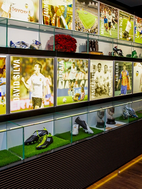 Valencia CF Mestalla Forevertour display with player memorabilia and trophies.