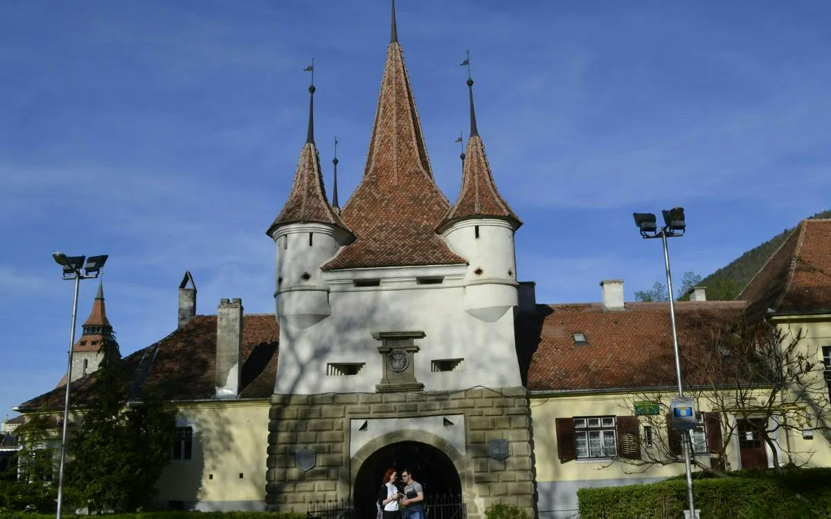 Brasov's Catherine's Gate with tourists, part of the Romantic Brasov Lady and the Knight game.
