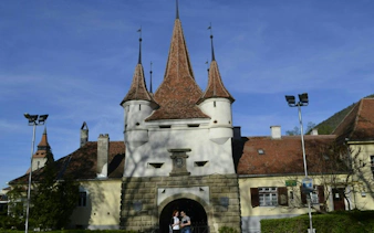Brasov's Catherine's Gate with tourists, part of the Romantic Brasov Lady and the Knight game.