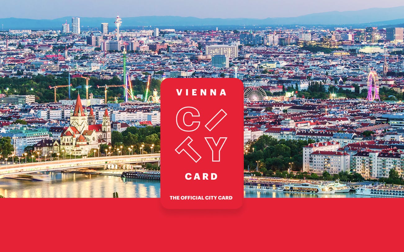 Aerial view of Vienna with skyscrapers, historic buildings, and riverside promenade.