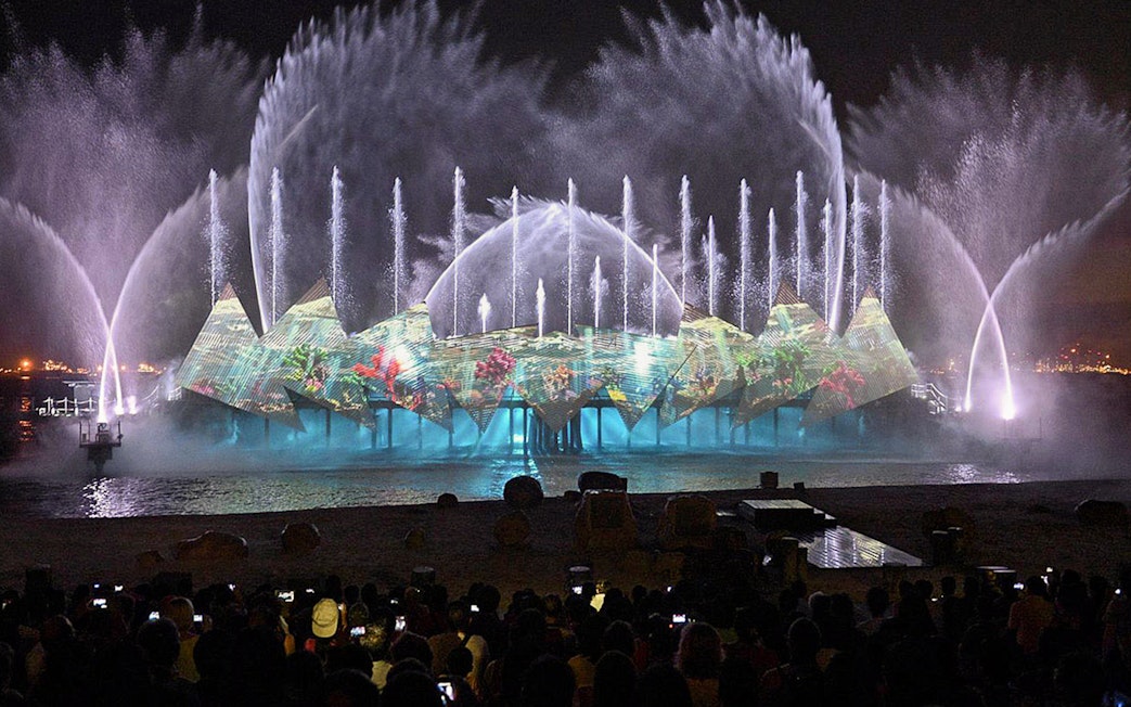Audience watching fireworks at Wings of Time show, Sentosa Island, Singapore.