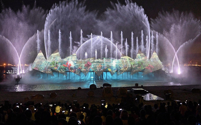 Audience watching fireworks at Wings of Time show, Sentosa Island, Singapore.