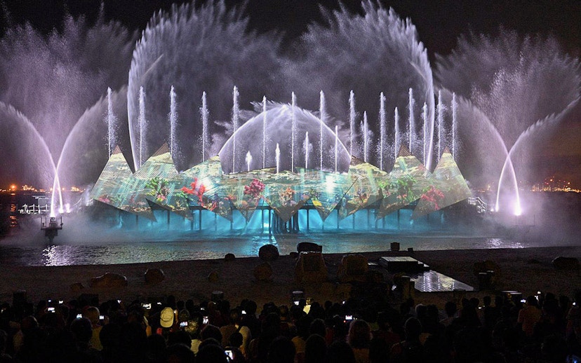 Audience watching fireworks at Wings of Time show, Sentosa Island, Singapore.