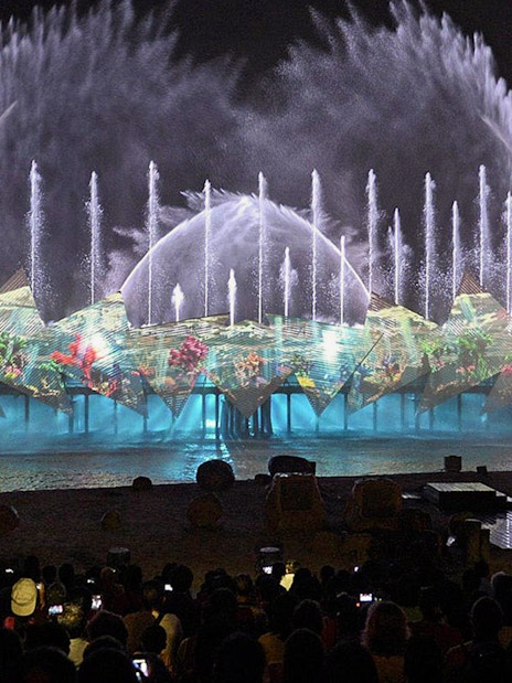 Audience watching fireworks at Wings of Time show, Sentosa Island, Singapore.