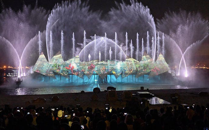 Audience watching fireworks at Wings of Time show, Sentosa Island, Singapore.