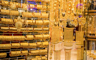 Gold jewelry display at Dubai Gold Souk during half-day sightseeing tour.