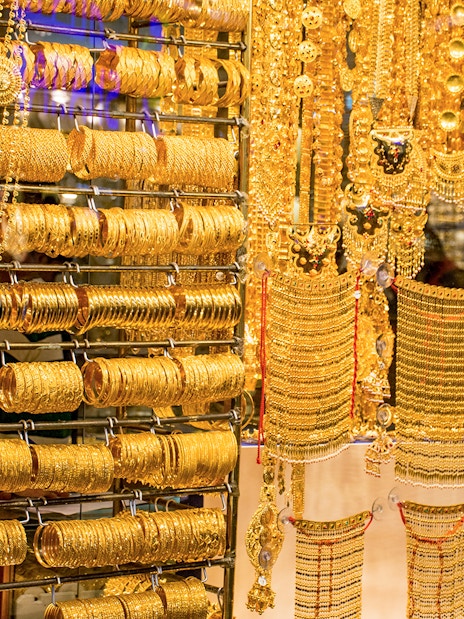Gold jewelry display at Dubai Gold Souk during half-day sightseeing tour.
