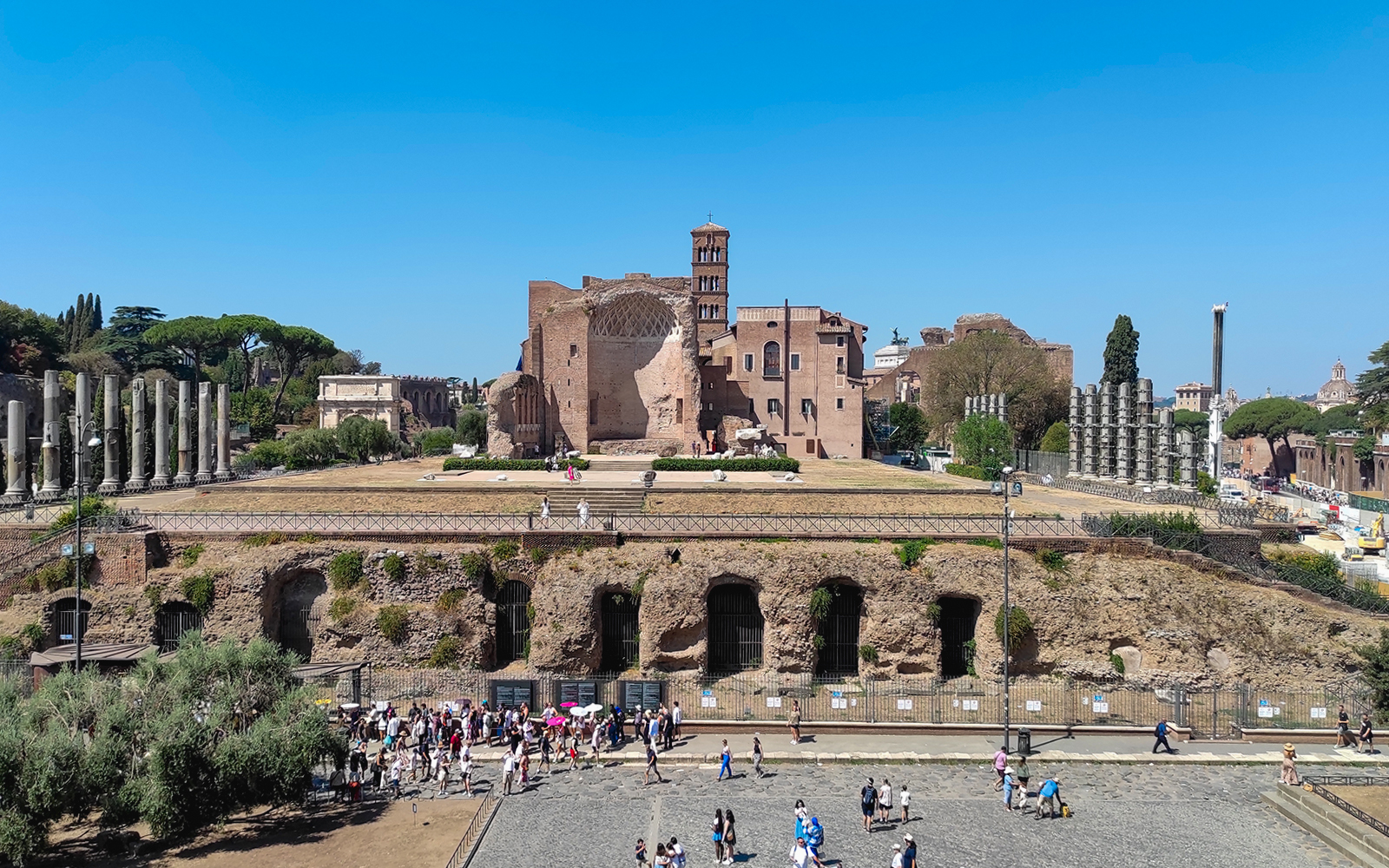 Roman Forum ruins with Palatine Hill in the background, Rome, Italy.