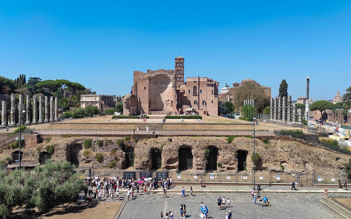 Roman Forum ruins with Palatine Hill in the background, Rome, Italy.