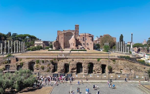 Roman Forum ruins with Palatine Hill in the background, Rome, Italy.