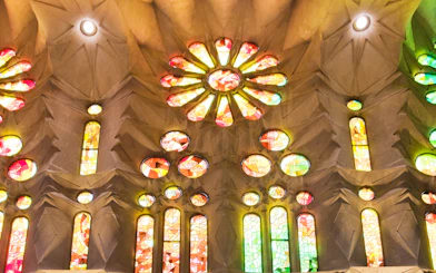 Stained glass windows inside Sagrada Familia, Barcelona, displaying vibrant colors.