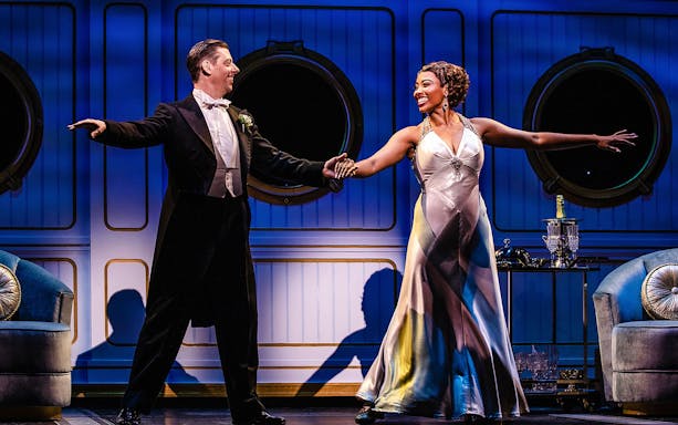 Performers dancing on stage in a scene from "Some Like it Hot" musical.