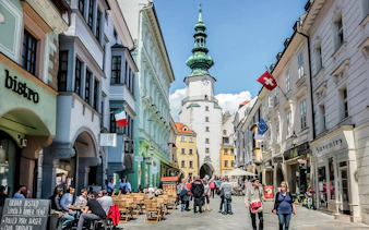 Bratislava walking tour with guests near Michael's Gate in the historic city center.