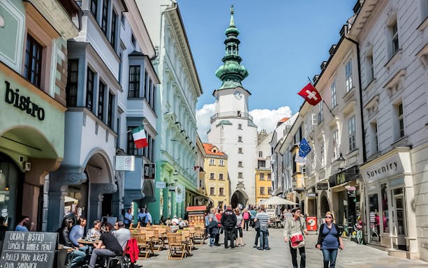 Bratislava walking tour with guests near Michael's Gate in the historic city center.