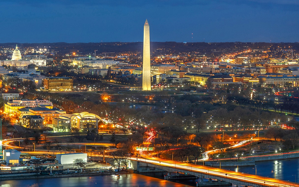 Washington D.C. night skyline with Washington Monument and Capitol Building on Big Bus tour route.