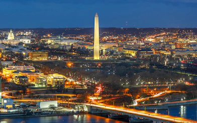 Washington D.C. night skyline with Washington Monument and Capitol Building on Big Bus tour route.
