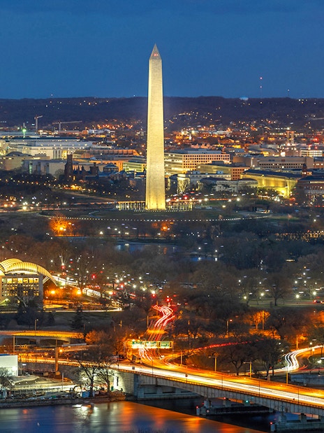 Washington D.C. night skyline with Washington Monument and Capitol Building on Big Bus tour route.
