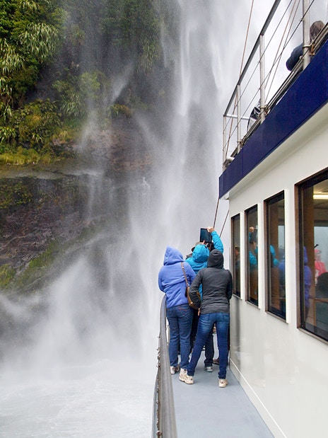Group on a boat viewing Stirling Falls at Milford Sound.