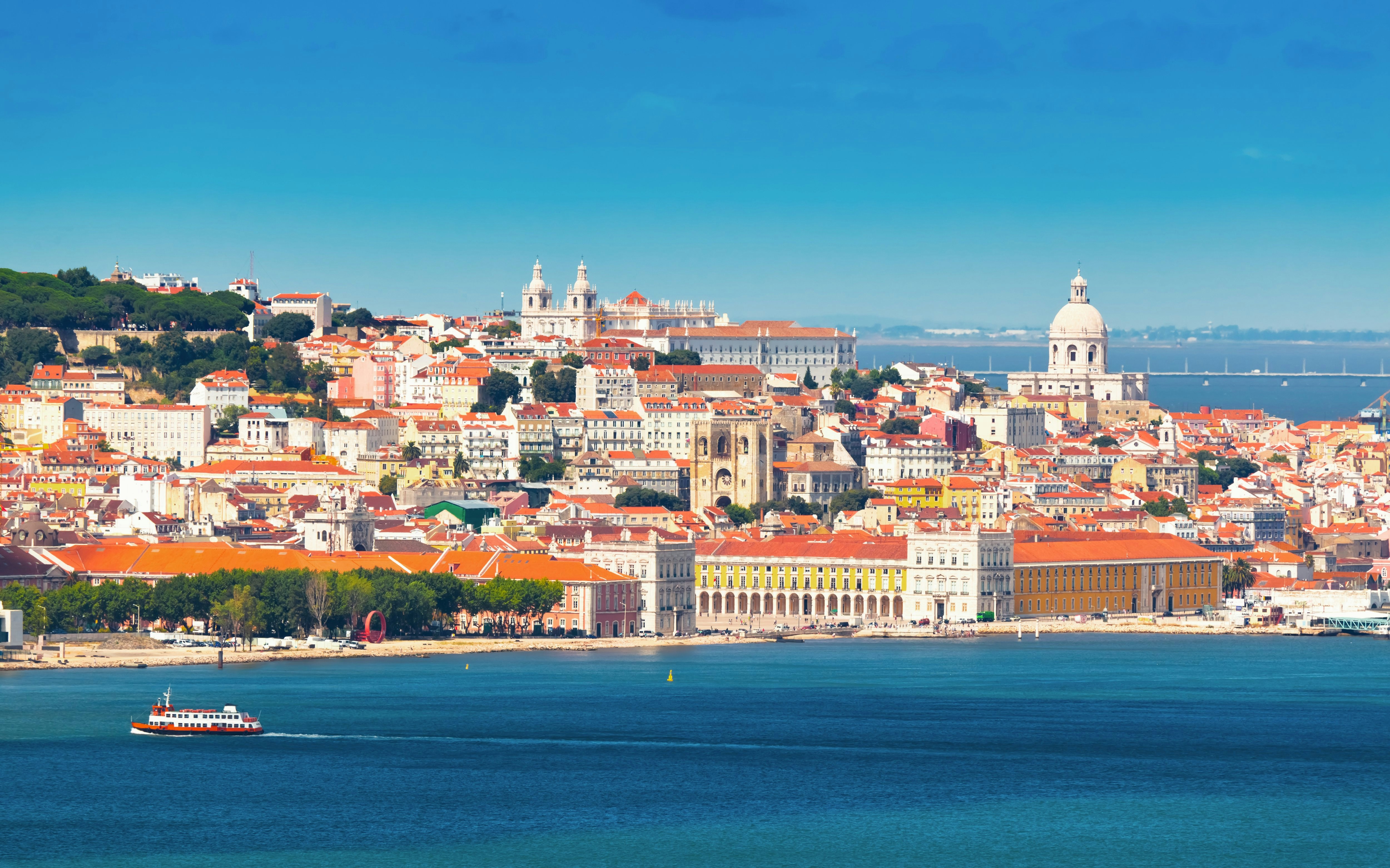 Lisbon cityscape with São Jorge Castle and Tagus River, Portugal.