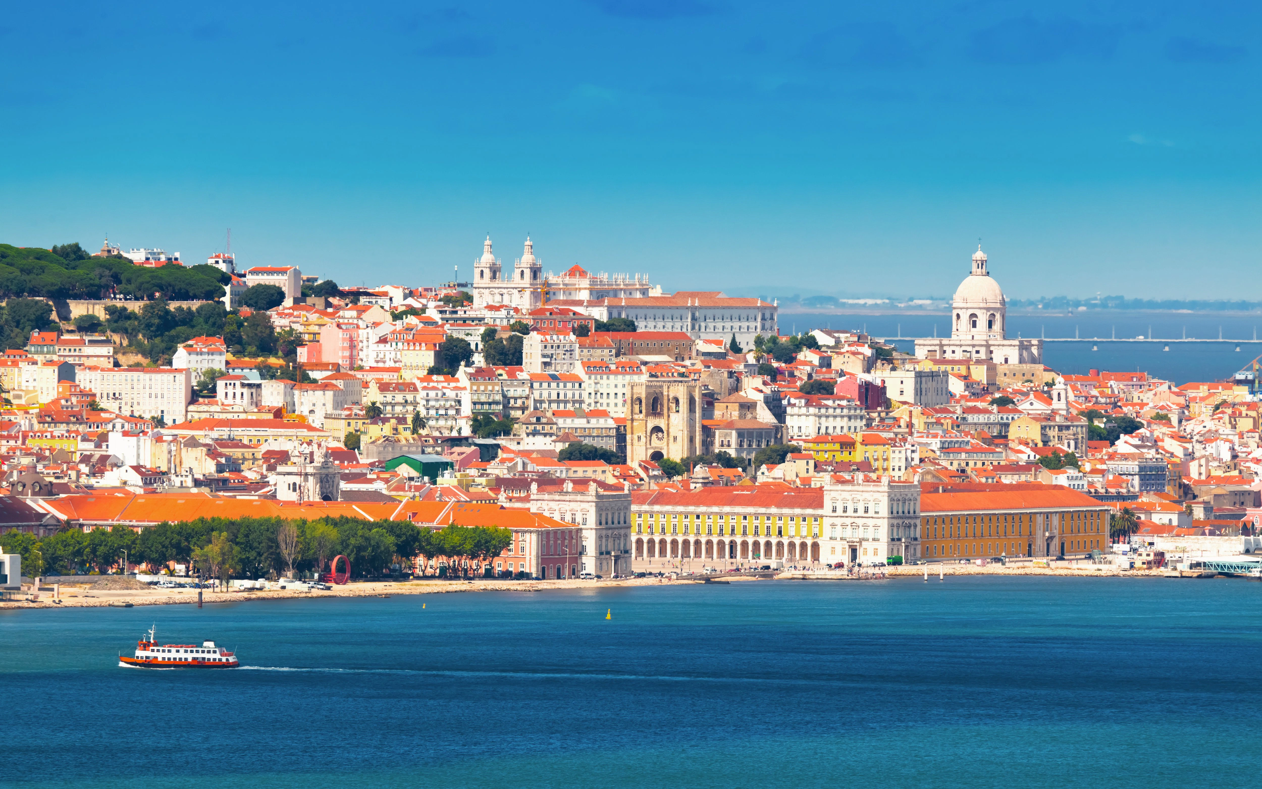 Lisbon cityscape with São Jorge Castle and Tagus River, Portugal.