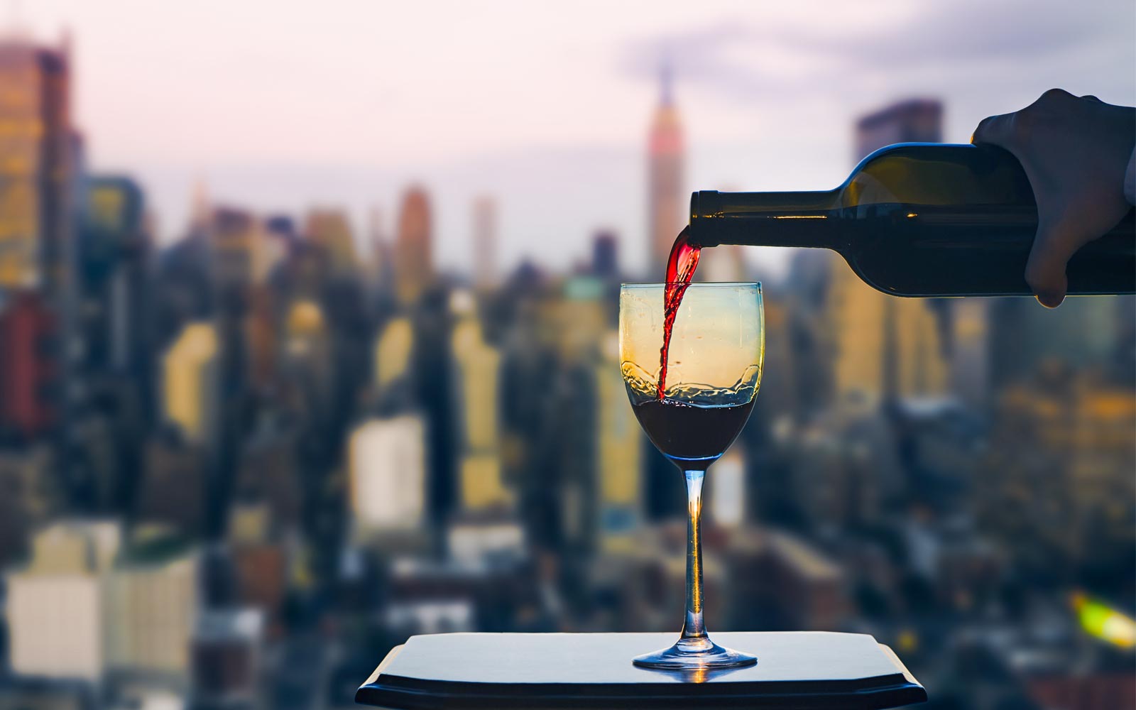Pouring wine at a rooftop new york restaurant