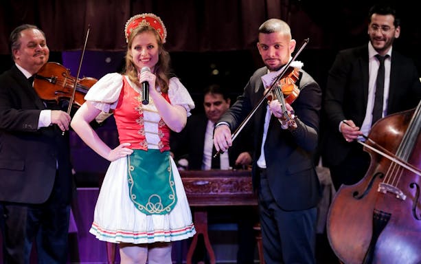 Folklore musicians and singer performing on Budapest dinner cruise.