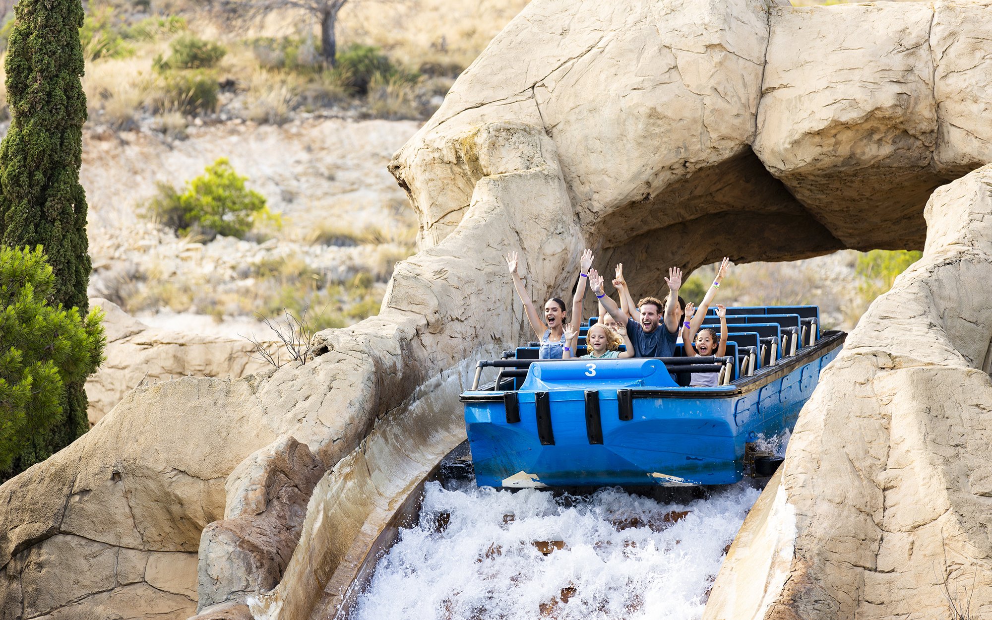 Visitors enjoying a water ride at Terra Mitica Benidorm.