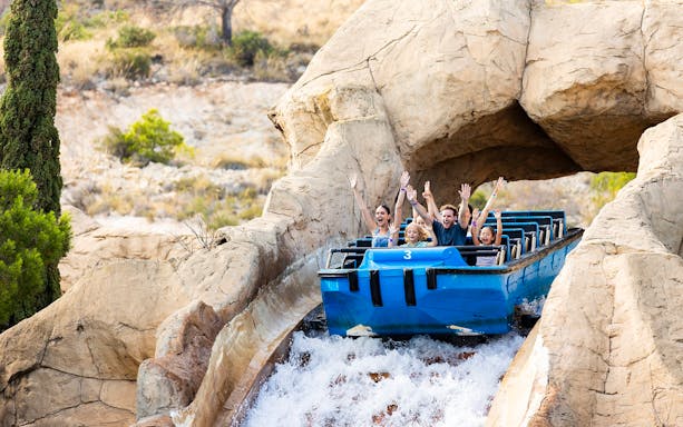 Visitors enjoying a water ride at Terra Mitica Benidorm.
