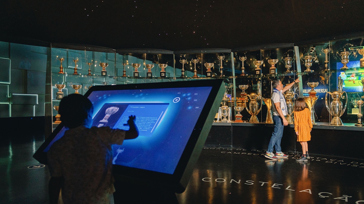 Visitors exploring exhibits in FC Porto Stadium Museum, Portugal.