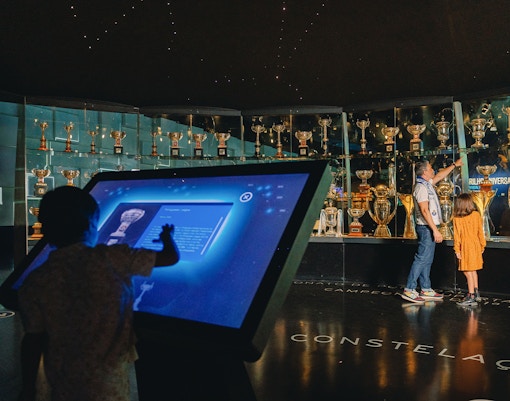 Visitors exploring exhibits in FC Porto Stadium Museum, Portugal.