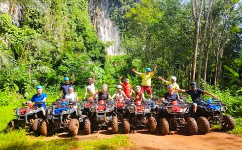 Group on ATVs in lush Krabi jungle, part of Emerald Pool and Hot Spring Waterfall tour.