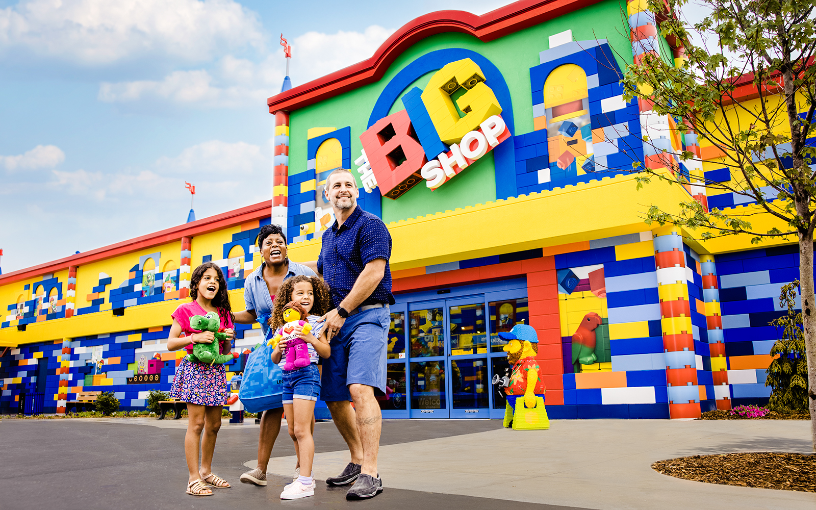 Guests enjoying the colorful entrance of The Big Shop at Legoland, New York.