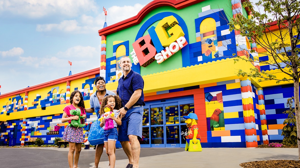 Guests enjoying the colorful entrance of The Big Shop at Legoland, New York.