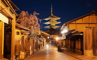 Yasaka Pagoda illuminated at night from Higashiyama District street, Kyoto.