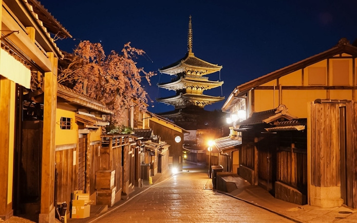 Yasaka Pagoda illuminated at night from Higashiyama District street, Kyoto.