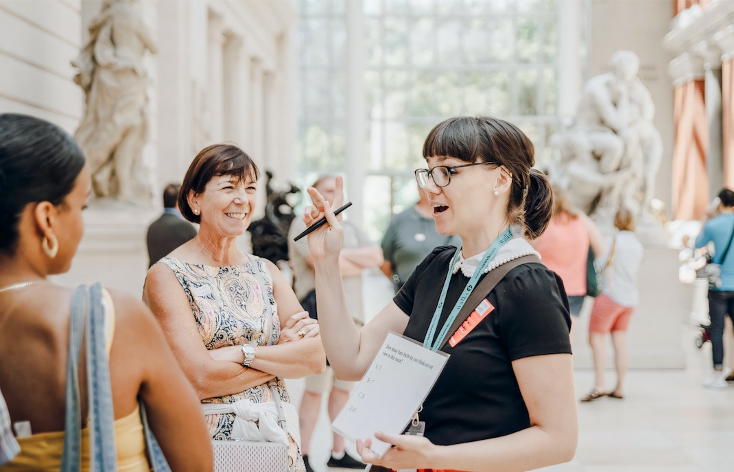 Guests with a guide exploring exhibits at the Metropolitan Museum of Art, New York City.