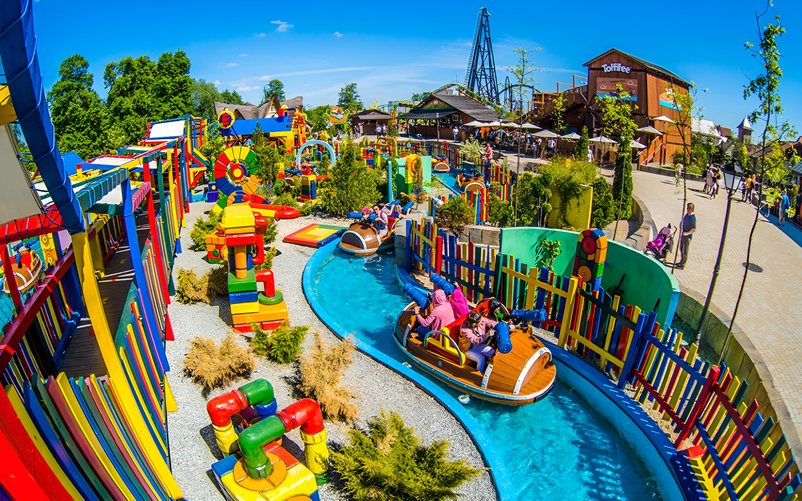 Children enjoying water ride at Energylandia Family Zone's Splash Battle in Poland.