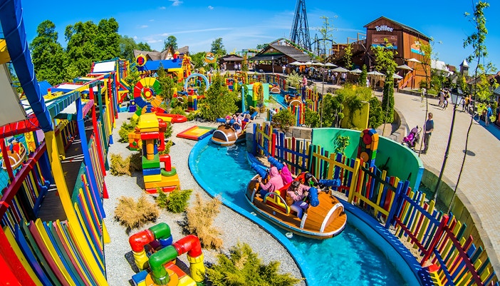 Children enjoying water ride at Energylandia Family Zone's Splash Battle in Poland.