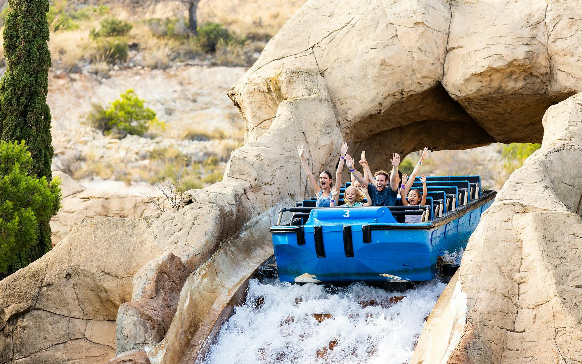 Visitors enjoying a water ride at Terra Mitica theme park in Spain.