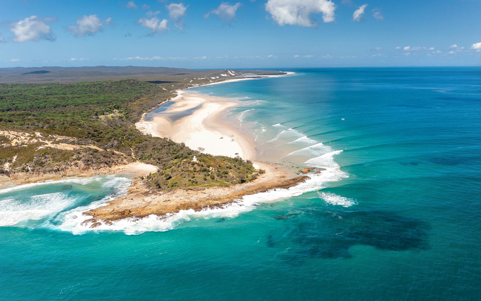 Aerial view of Moreton Island's North Point with sandy beaches and turquoise waters.