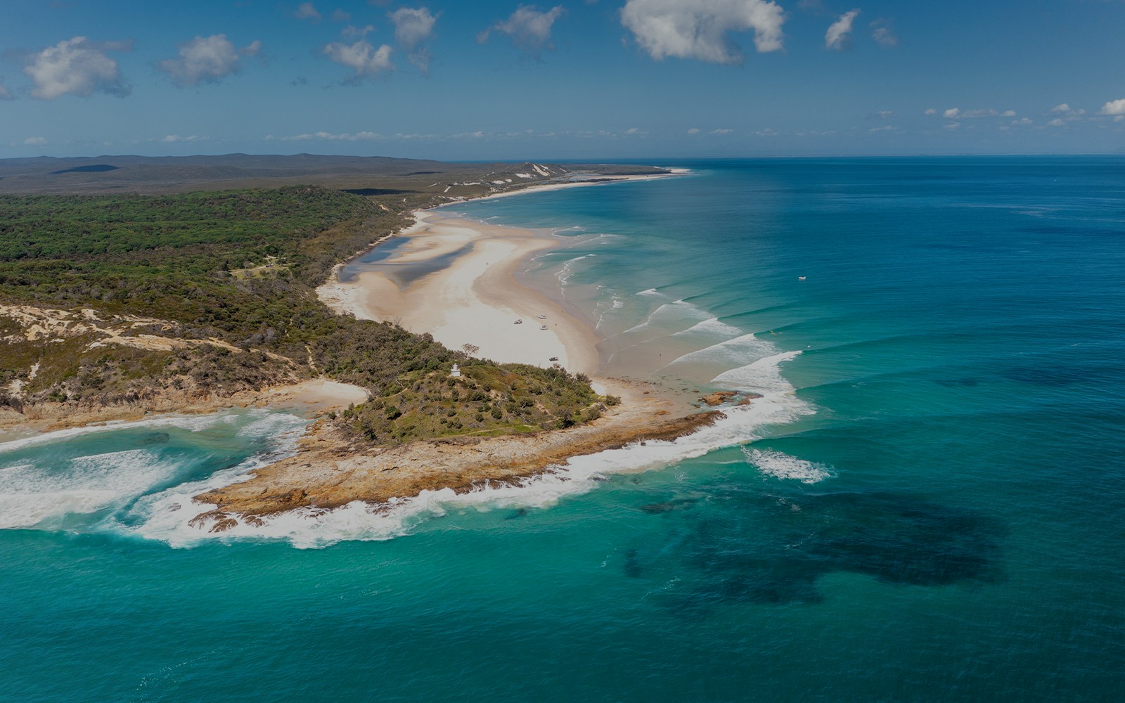 Aerial view of Moreton Island's North Point with sandy beaches and turquoise waters.