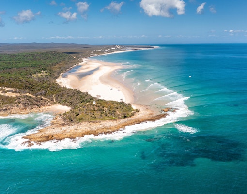 Aerial view of Moreton Island's North Point with sandy beaches and turquoise waters.