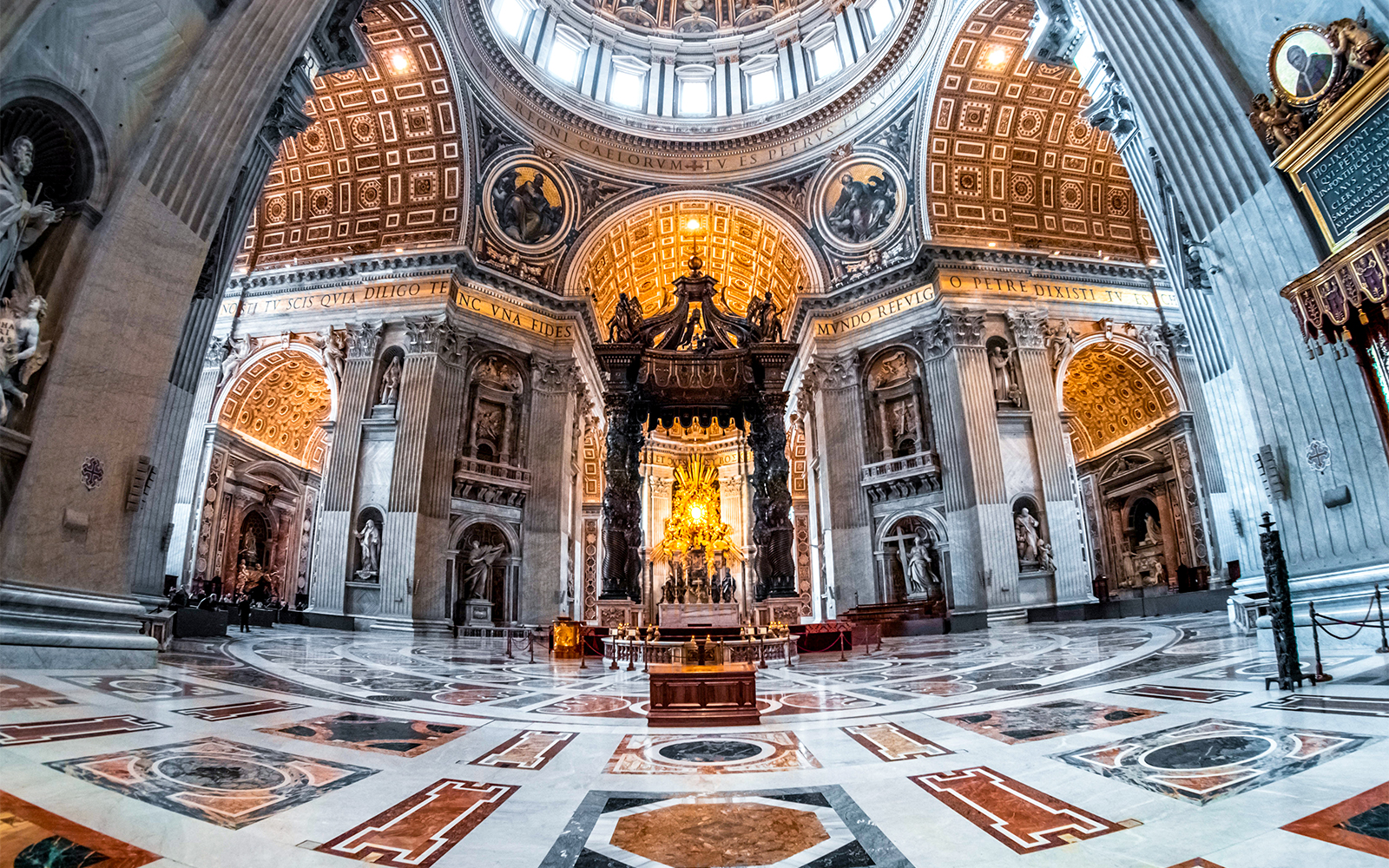 St. Peter's Basilica and Vatican City skyline at sunset.