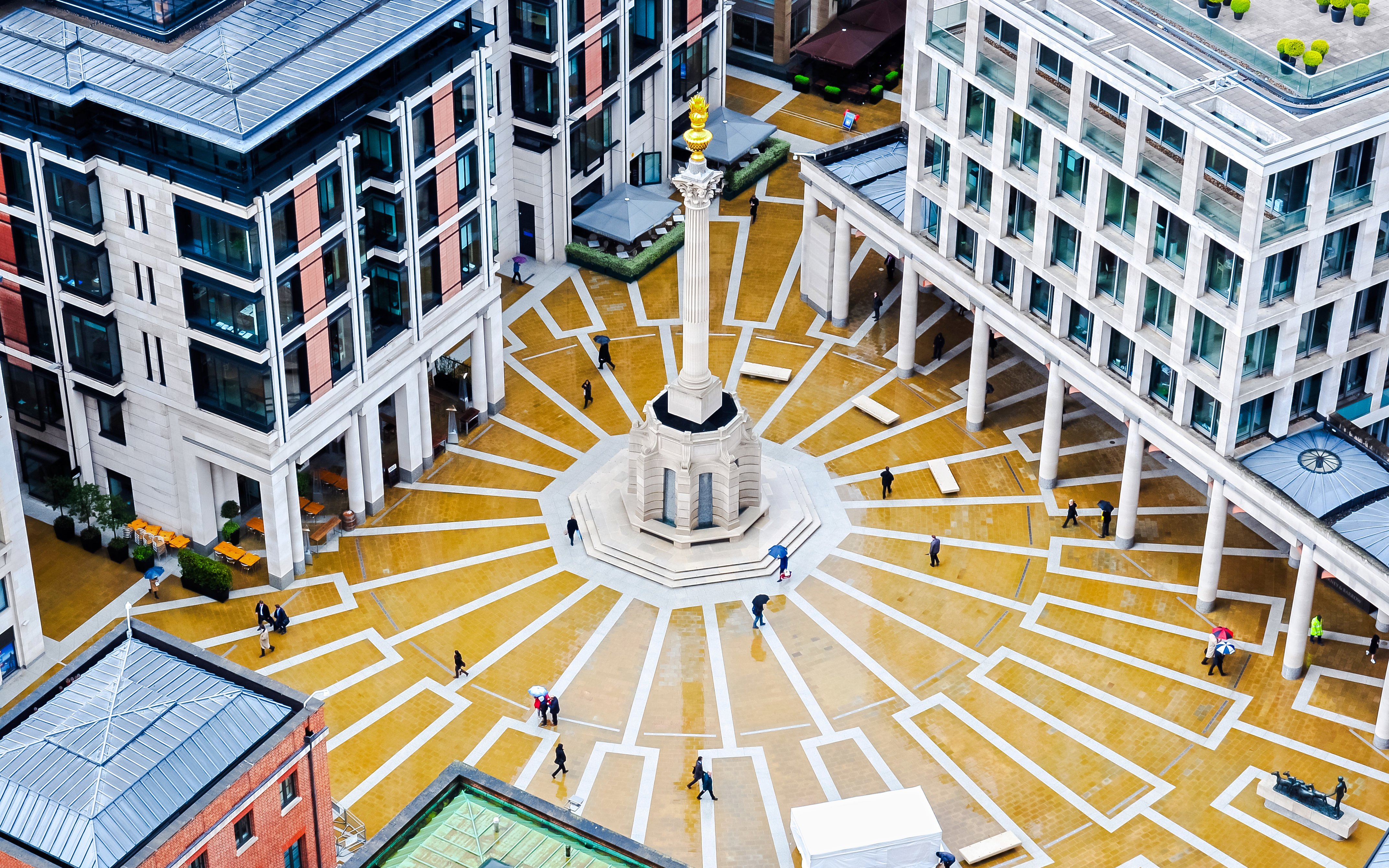Paternoster Square aerial view with central column and surrounding buildings in London, UK.