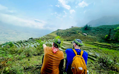 Tourists overlooking terraced rice fields in Lao Chai, Sapa during a day tour.