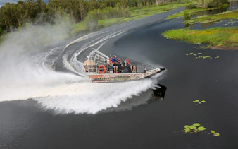 Airboat speeding on Finniss River during Top End Safari Camp tour from Darwin.