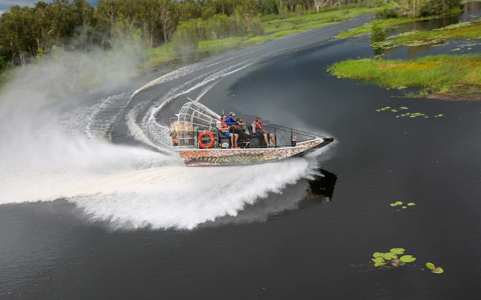 Airboat speeding on Finniss River during Top End Safari Camp tour from Darwin.