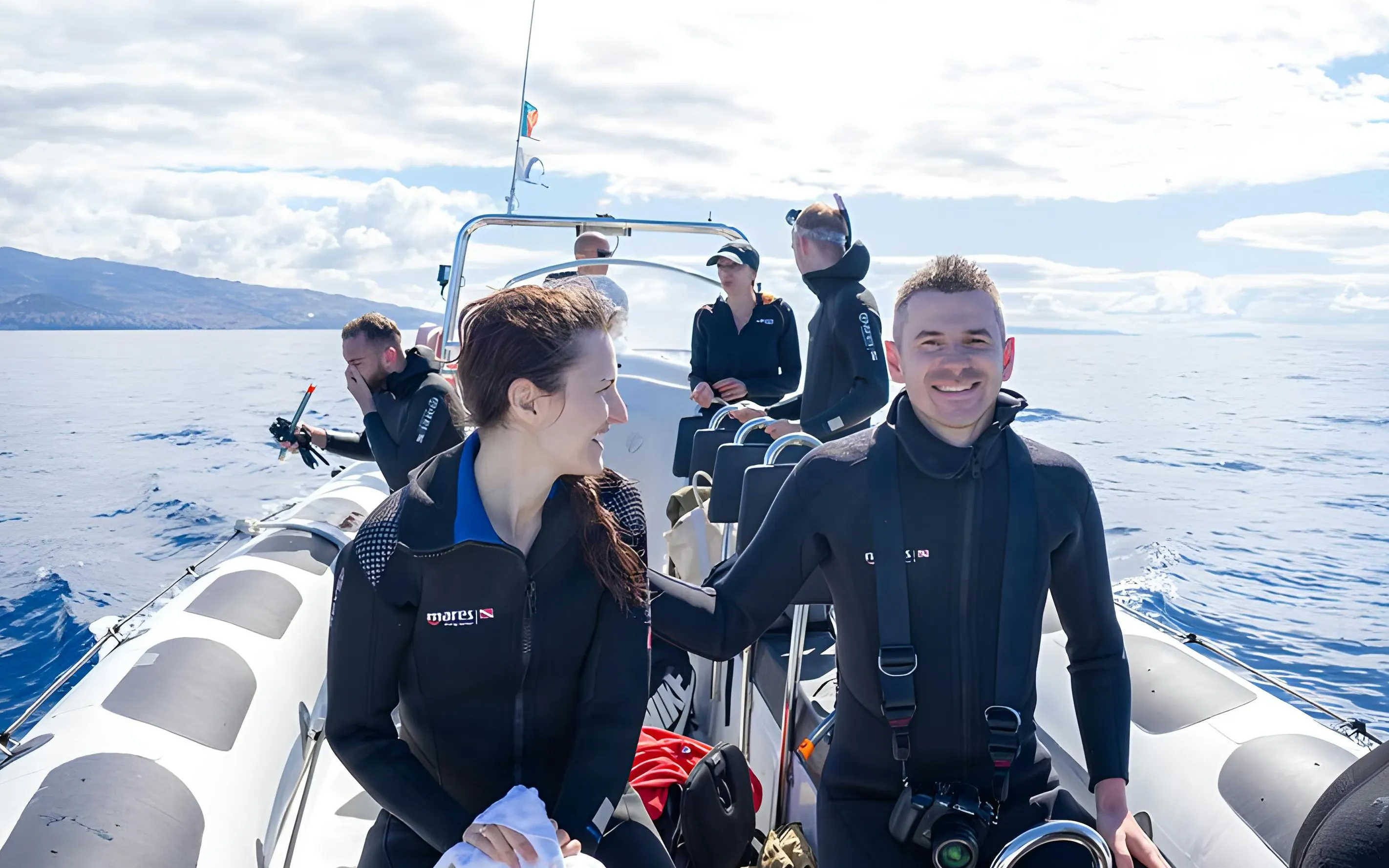 People on a speedboat in Madeira, preparing for dolphin and whale watching.