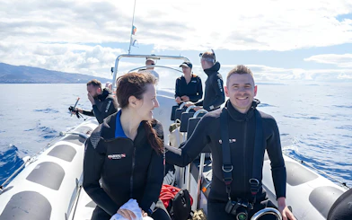 People on a speedboat in Madeira, preparing for dolphin and whale watching.