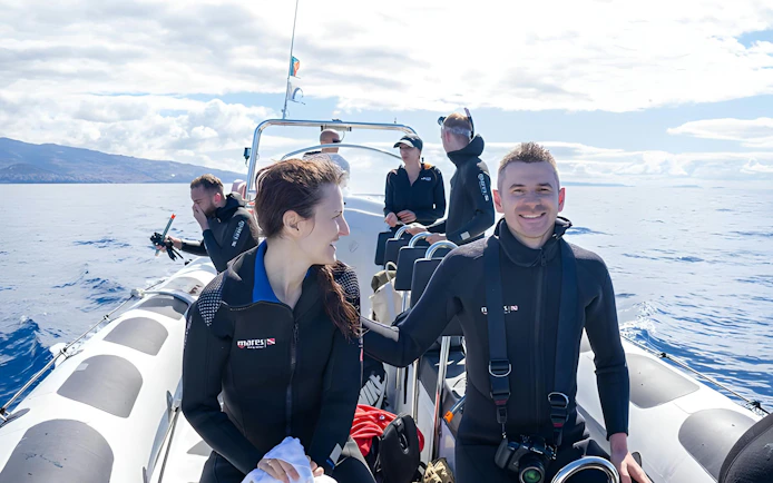 People on a speedboat in Madeira, preparing for dolphin and whale watching.
